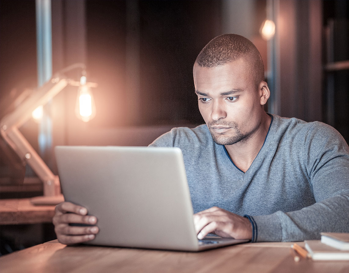 stock-photo-man-working-late-in-office-2275934687